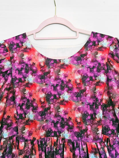 Pink and purple space print dress, close-up on bodice