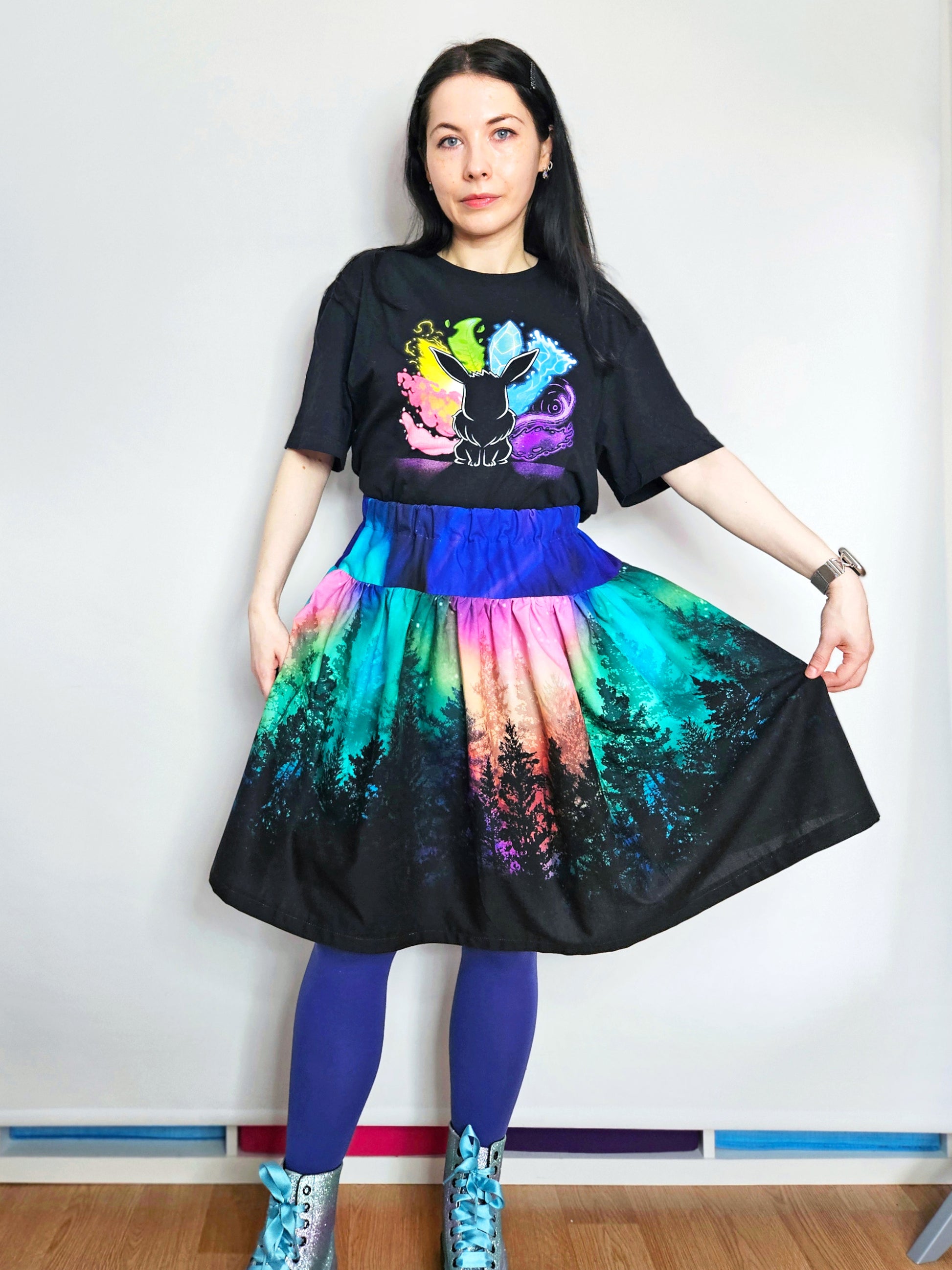 Woman wearing skirt with colourful aurora print
