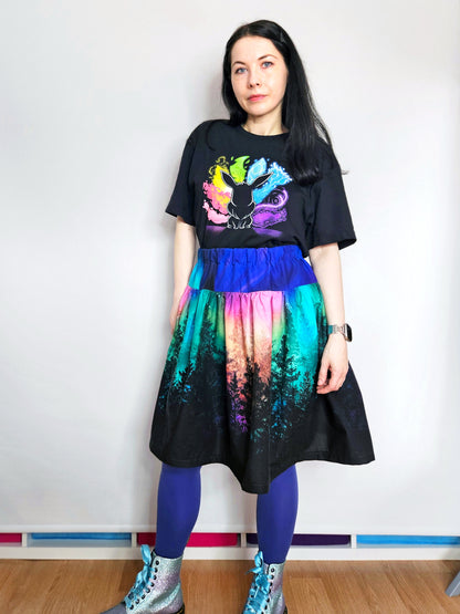 Woman wearing skirt with colourful aurora print