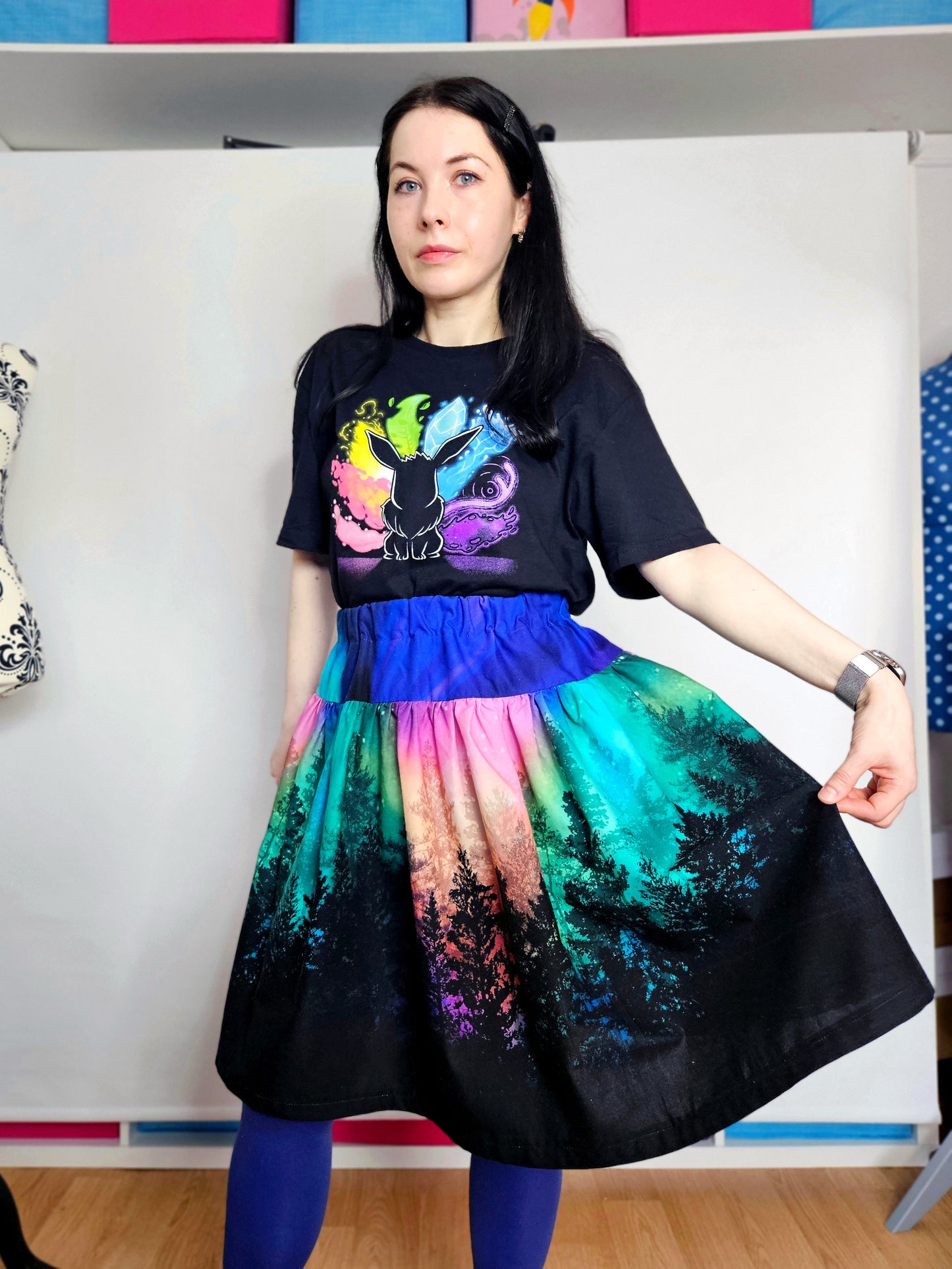 Woman wearing skirt with colourful aurora print