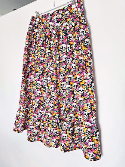 Skirt with colourful skull and floral pattern on a white background