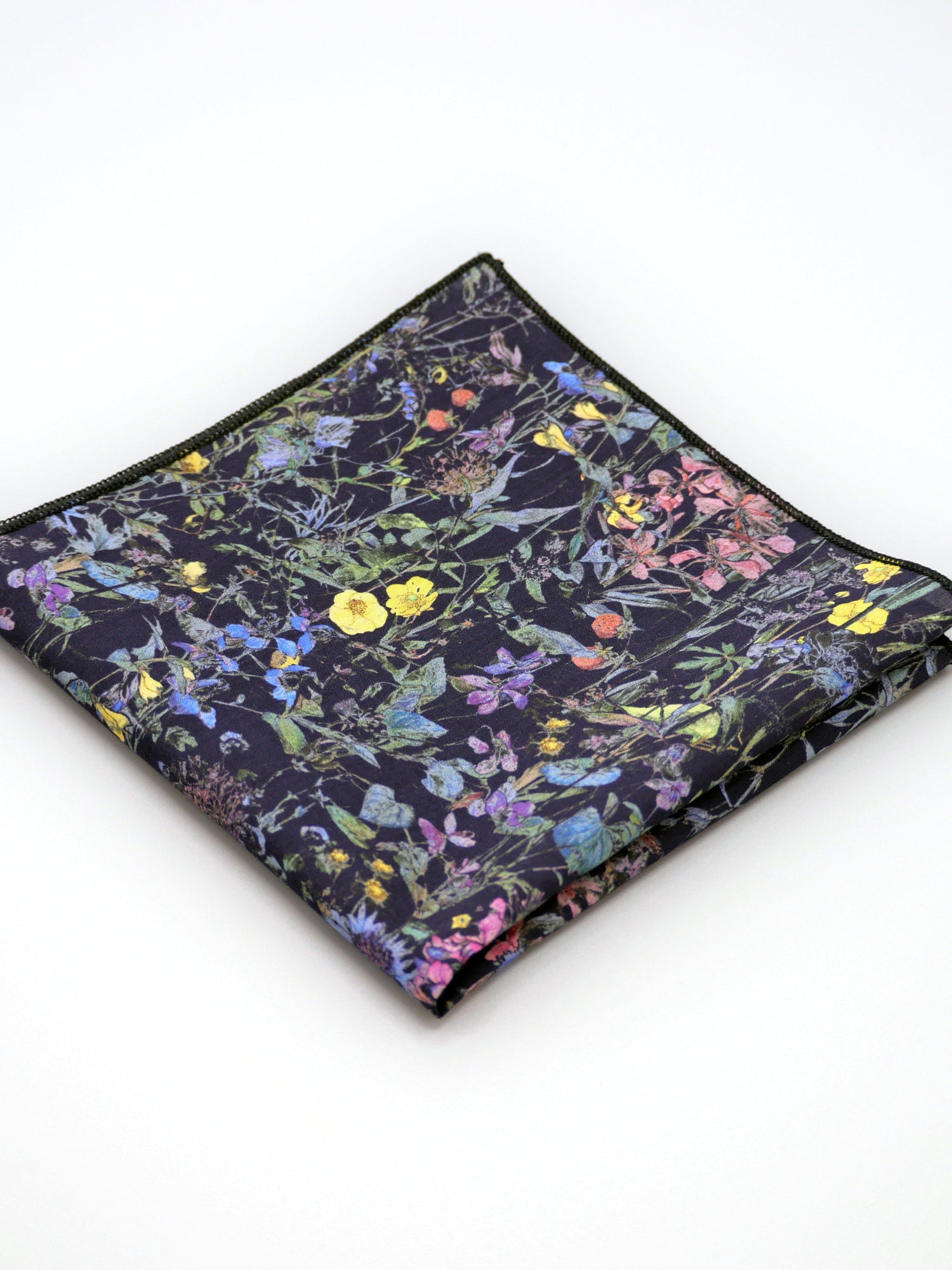 Floral patterned Liberty print pocket square on a pale grey background