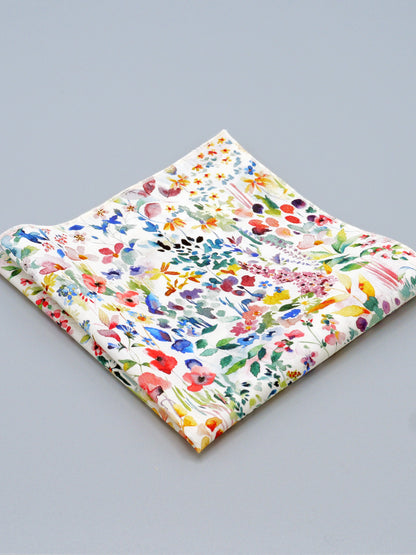 Colourful floral patterned pocket square on a grey background