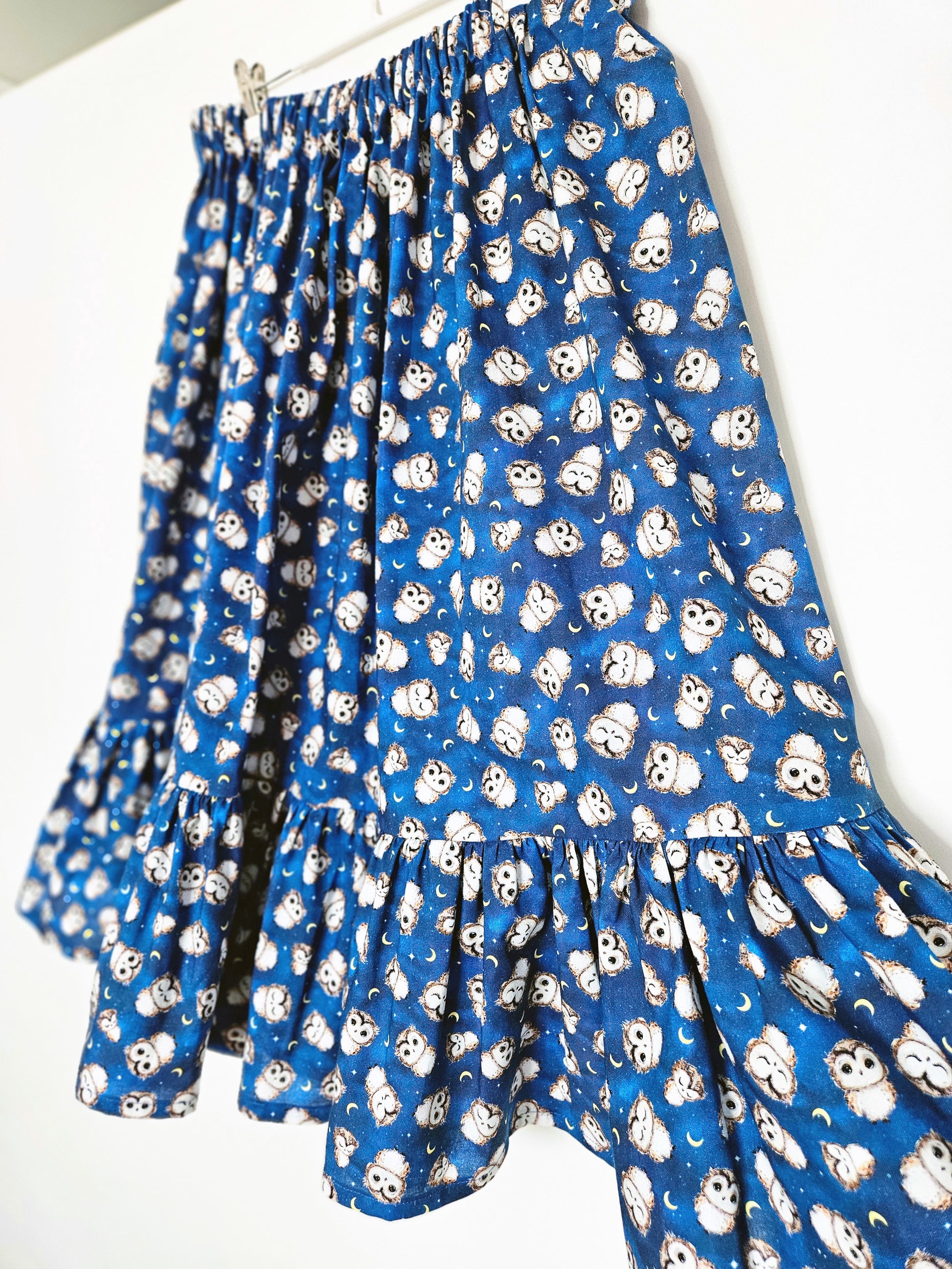 blue owl print skirt against a white background