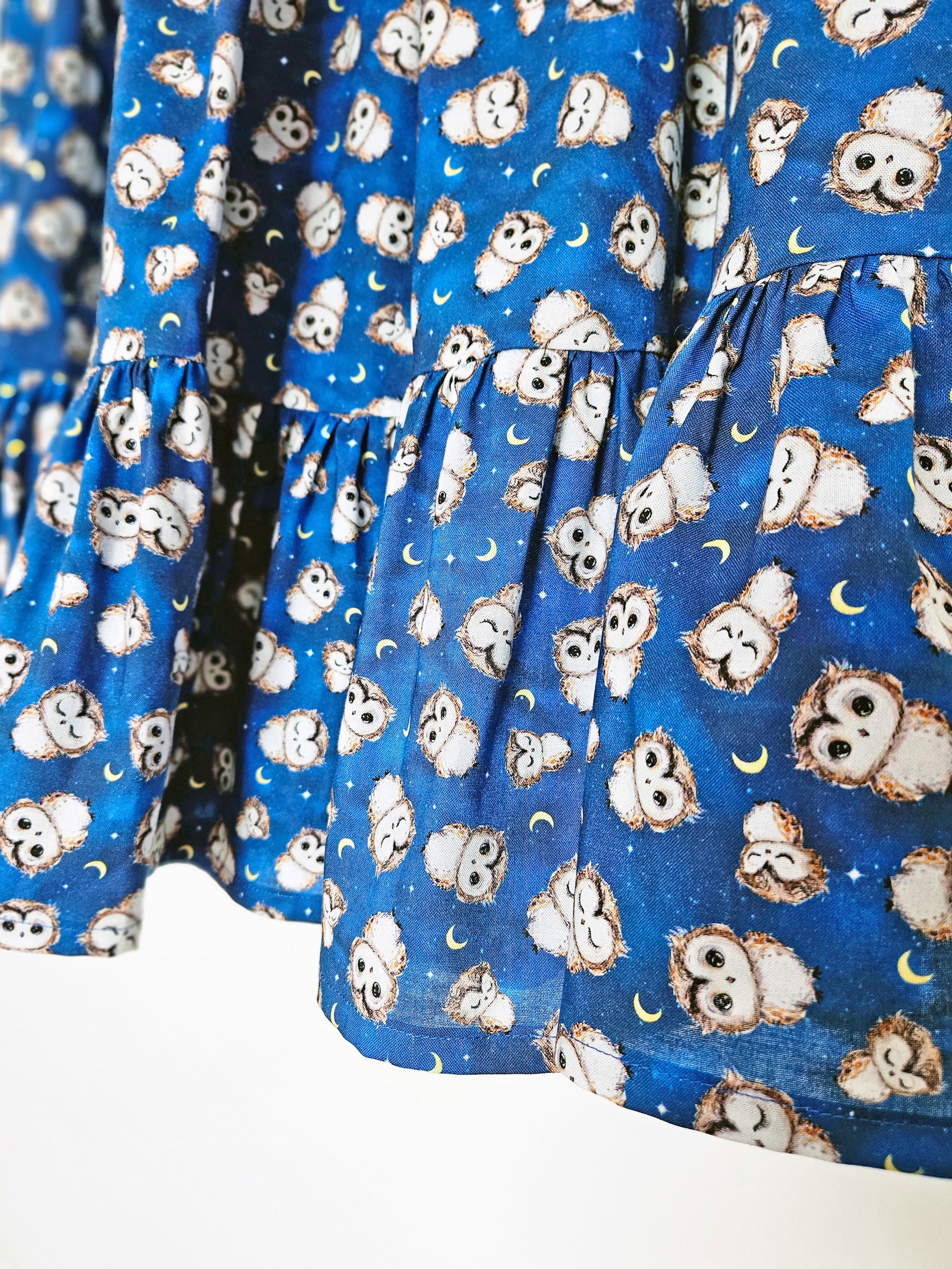 close up of a blue owl print skirt