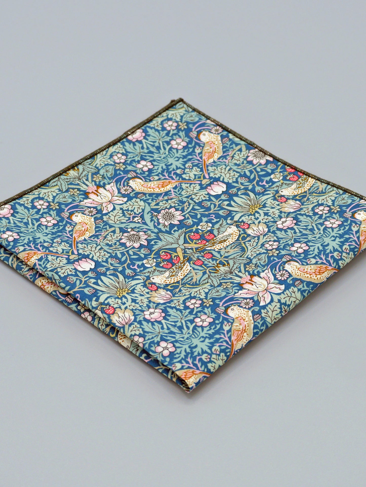 William Morris Strawberry Thief print floral patterned pocket square with a bird and strawberry motif
