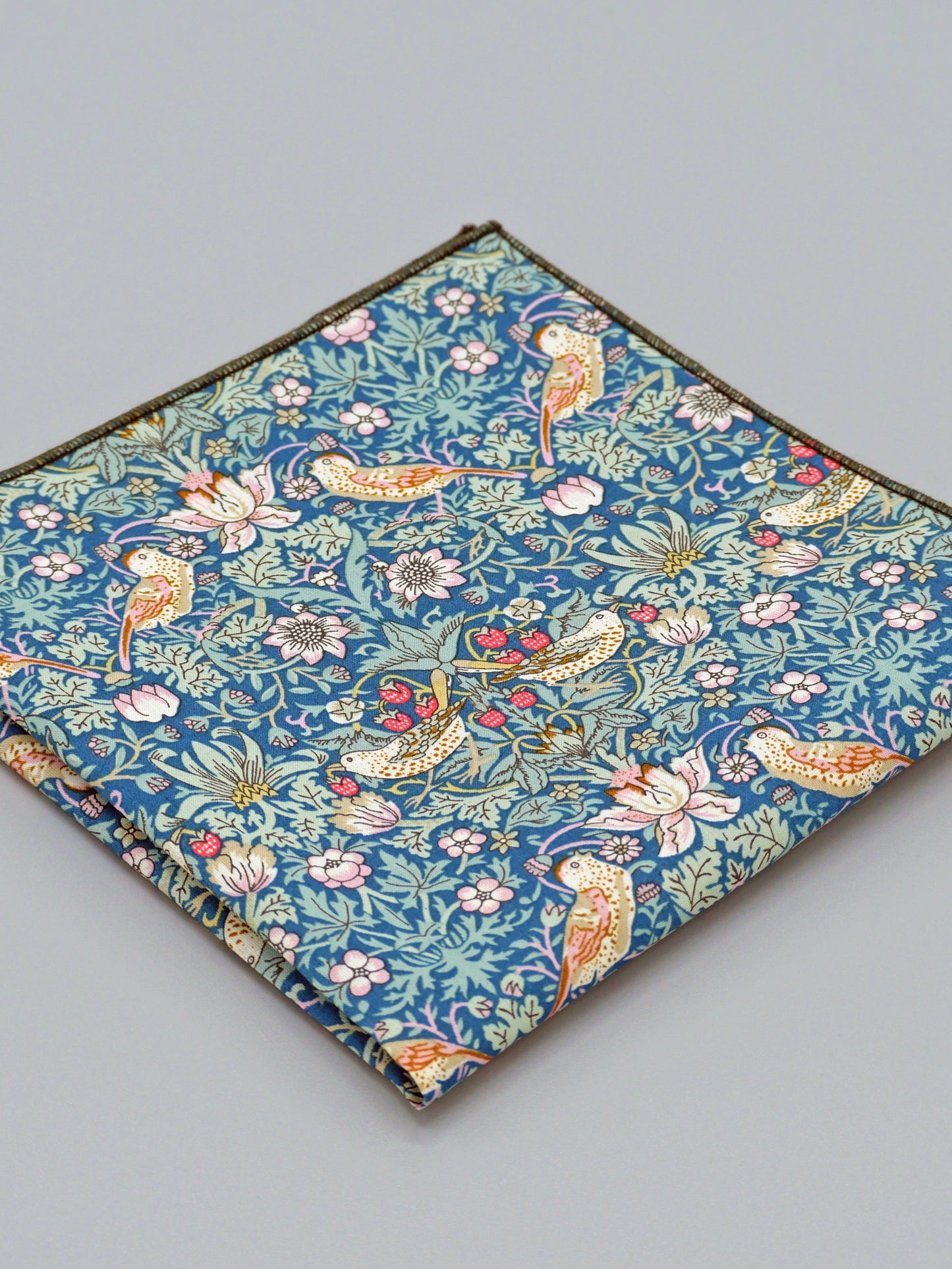 William Morris Strawberry Thief print floral patterned pocket square with a bird and strawberry motif