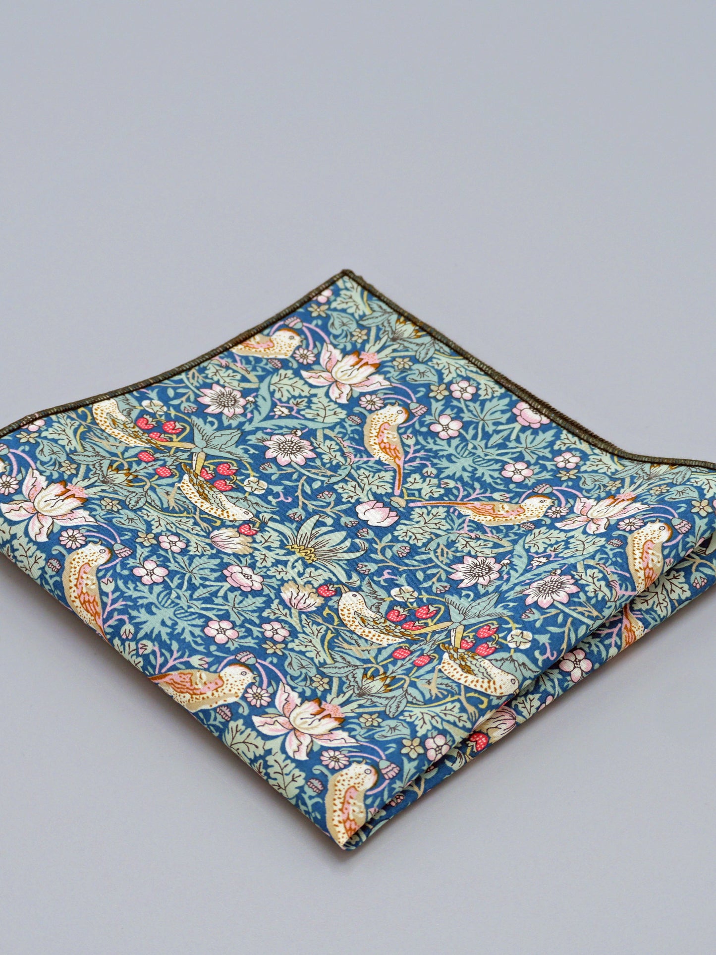 William Morris Strawberry Thief print floral patterned pocket square with a bird and strawberry motif