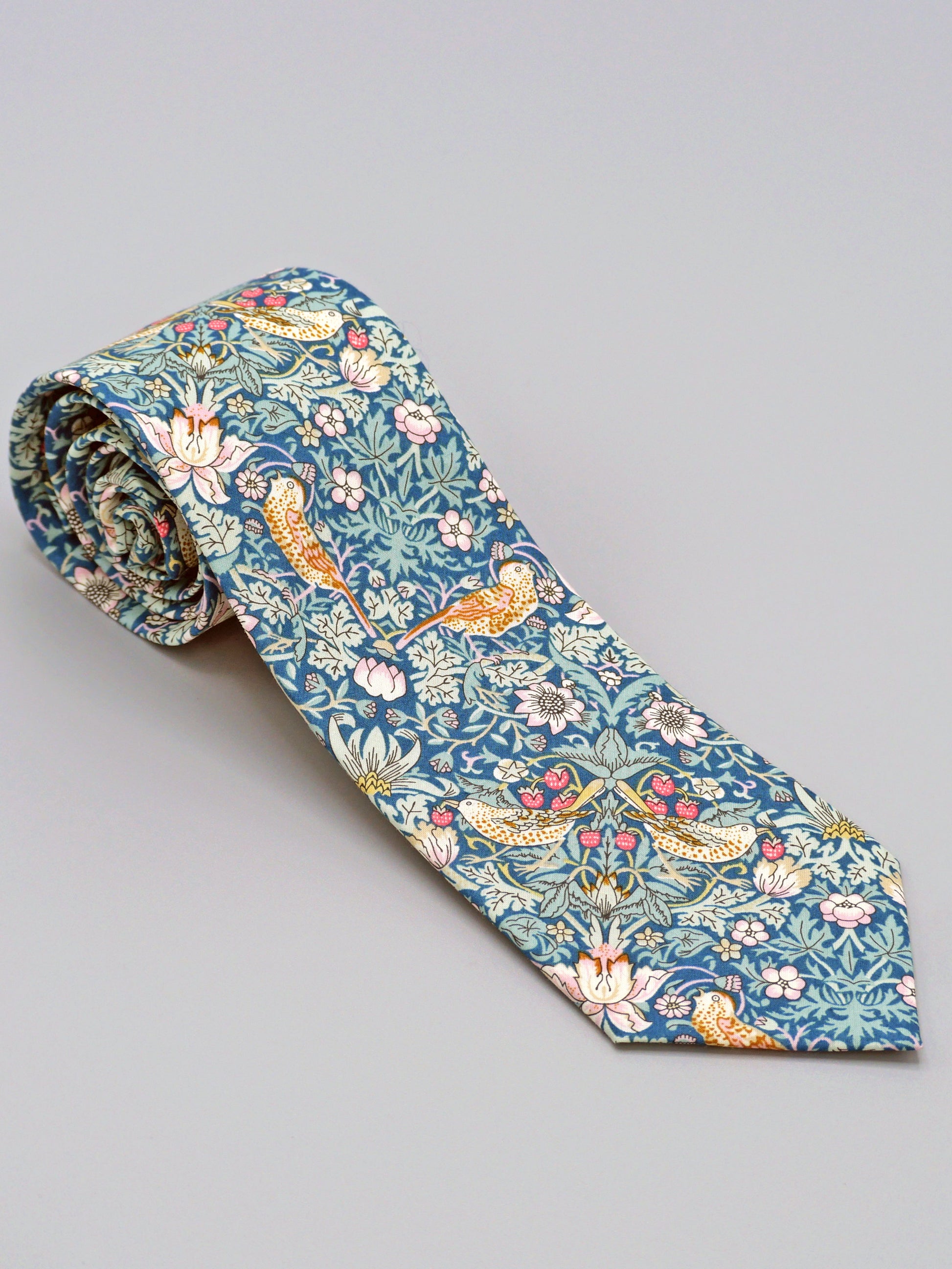 William Morris Strawberry Thief print floral patterned tie with a bird and strawberry motif
