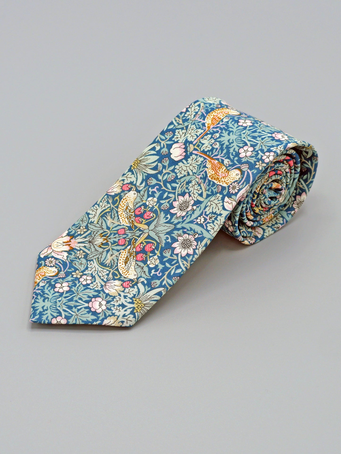 William Morris Strawberry Thief print floral patterned tie with a bird and strawberry motif