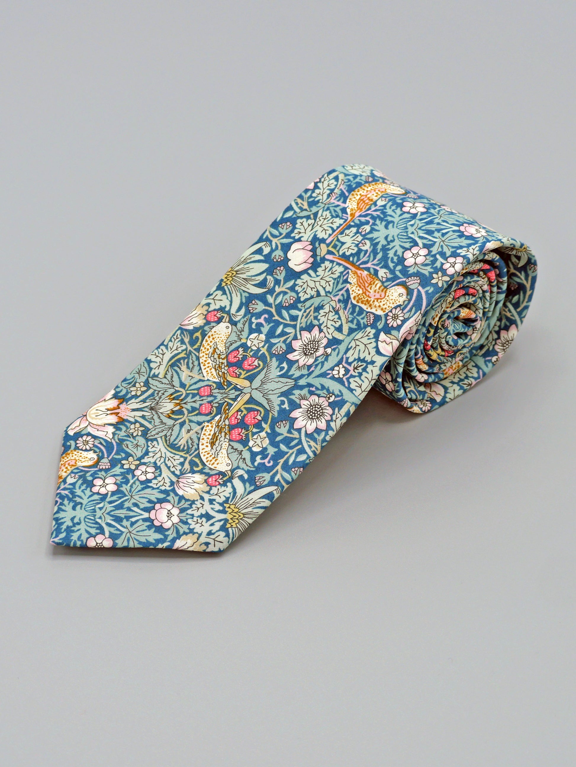William Morris Strawberry Thief print floral patterned tie with a bird and strawberry motif