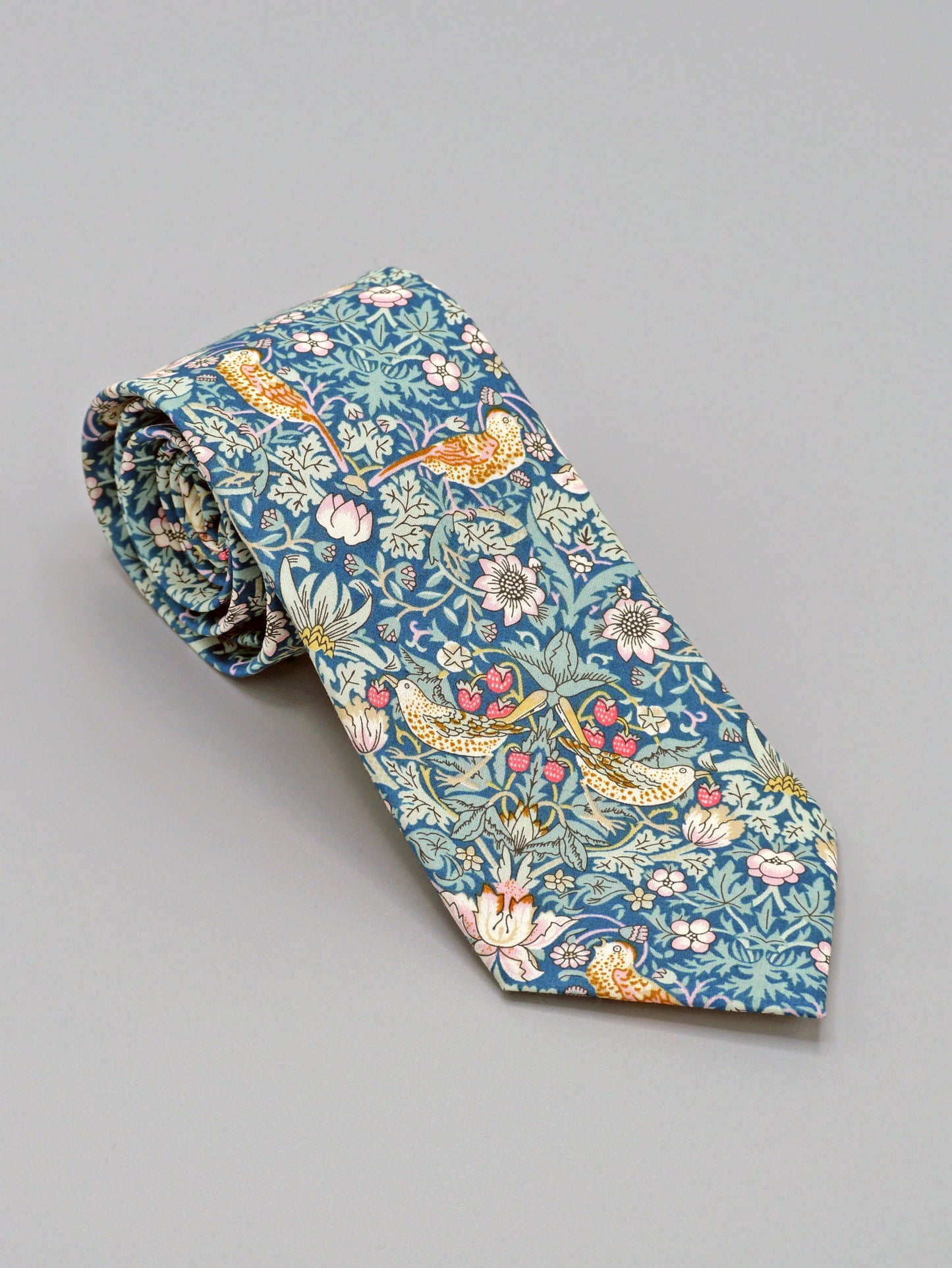 William Morris Strawberry Thief print floral patterned tie with a bird and strawberry motif