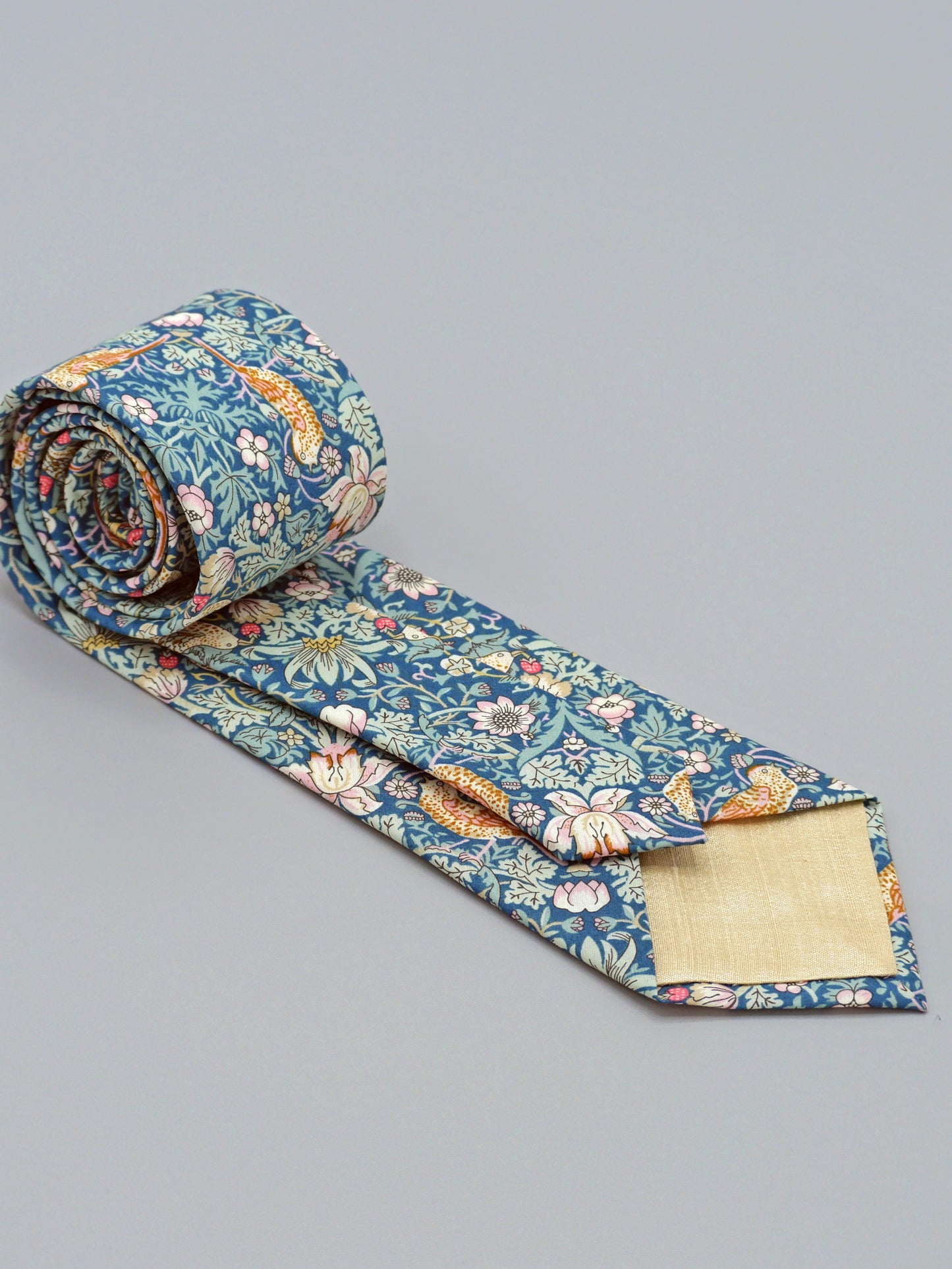 William Morris Strawberry Thief print floral patterned tie with a bird and strawberry motif and cream lining