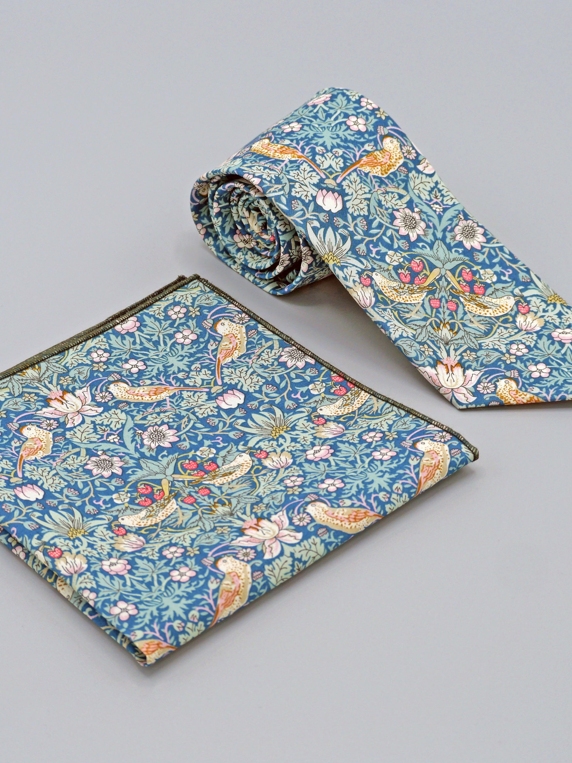William Morris Strawberry Thief print floral patterned tie and a matching pocket square with a bird and strawberry motif