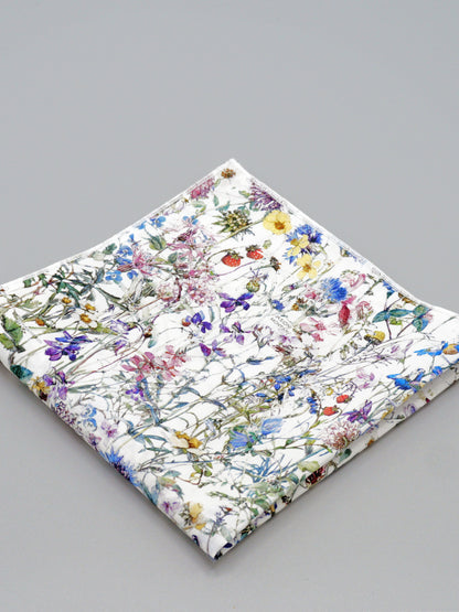 Floral patterned pocket square on a grey background