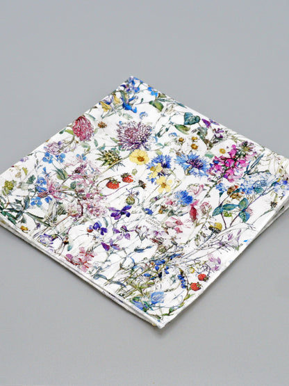 Floral patterned pocket square on a grey background